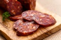 Spanish chorizo sausage with parsley on rustic boa Royalty Free Stock Photo