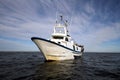 Trawler fishing boat ready to use nets.