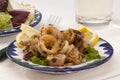 Spanish cuisine. Andalusian deep-fried squids. Royalty Free Stock Photo