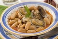 Spanish Cuisine. Asturian clams and beans. Royalty Free Stock Photo