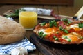 Spanish cuisine. Eggs on vegetables, Andalusian style. Huevos a la flamenca. Royalty Free Stock Photo