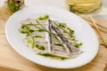 Spanish Cuisine. Marinated fresh anchovies. Boquerones. Royalty Free Stock Photo
