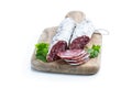 Spanish dry cured sausages salami with parsley and spices on wooden board Royalty Free Stock Photo