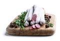 Spanish dry cured sausages salami with rosemary and spices on wooden board Royalty Free Stock Photo