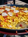 Spanish eggs with chorizo, potatoes and peppers to the frying pan. Royalty Free Stock Photo