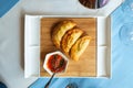 Spanish empanadas with sauce on restaurant table