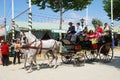 Spanish family in a horse drawn carriage.