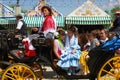 Spanish family in horse drawn carriage.