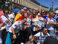 Spanish fans taking photo with people in fan zone