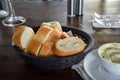 Spanish fresh bread on a basket on a restaurant table. Royalty Free Stock Photo