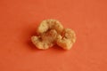 Spanish fried bacon snack on orange background Royalty Free Stock Photo