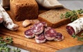 Spanish fuet sausage sliced ??on a cutting board. Royalty Free Stock Photo