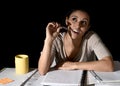 Spanish girl studying tired and bored at home late night absent Royalty Free Stock Photo