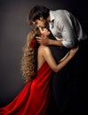 Spanish Girl. Woman in Red Dress with Boyfriend side view Kiss. Valentines Day Royalty Free Stock Photo