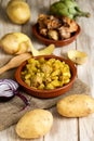 Spanish guiso de patatas con albondigas, a stew with potatotes a