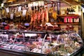 Spanish hamon in barcelona market, jamon iberico in view black leg pork isolated, traditional national spain meat in