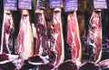 Spanish hamon in barcelona market, jamon iberico in view black leg pork isolated, traditional national spain meat in store Royalty Free Stock Photo