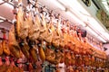 Spanish hamon in Valencia market, jamon iberico in view black leg pork isolated, traditional national spain meat in Royalty Free Stock Photo