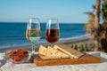 Spanish hard Andalusian cheese filled with sweet sherry served outdoor with membrillo jam with two glasses of sherry wine with Royalty Free Stock Photo