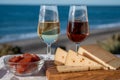 Spanish hard Andalusian cheese filled with sweet sherry served outdoor with membrillo jam with two glasses of sherry wine with Royalty Free Stock Photo