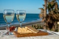 Spanish hard Andalusian cheese filled with sweet sherry served outdoor with membrillo jam with two glasses of white wine with Royalty Free Stock Photo