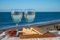 Spanish hard Andalusian cheese filled with sweet sherry served outdoor with membrillo jam with two glasses of white wine with Royalty Free Stock Photo