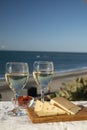 Spanish hard Andalusian cheese filled with sweet sherry served outdoor with membrillo jam with two glasses of white wine with Royalty Free Stock Photo