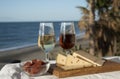 Spanish hard Andalusian cheese filled with sweet sherry served outdoor with membrillo jam with two glasses of sherry wine with Royalty Free Stock Photo