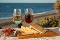 Spanish hard Andalusian cheese filled with sweet sherry served outdoor with membrillo jam with two glasses of sherry wine with Royalty Free Stock Photo