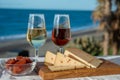 Spanish hard Andalusian cheese filled with sweet sherry served outdoor with membrillo jam with two glasses of sherry wine with Royalty Free Stock Photo