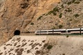 Spanish high-speed train passing through the tunnel of the steep and narrow Tajo de la Encantada Canyon in southern Spain
