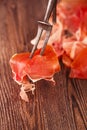 Spanish jamon Cured Meat on large vintage meat fork