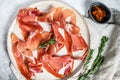 Spanish jamon Serrano, ham. Antipasto plate. Gray background, top view Royalty Free Stock Photo