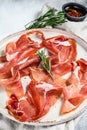 Spanish jamon Serrano, ham. Antipasto plate. Gray background, top view Royalty Free Stock Photo