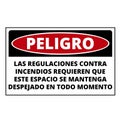 Spanish language danger fire regulations demand that this place be clear at all times sign Royalty Free Stock Photo