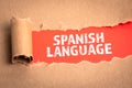 Spanish Language. Torn cardboard on a red background Royalty Free Stock Photo