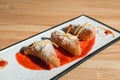 Spanish Leche Frita Dessert, decorated with jam close-up on a plate.