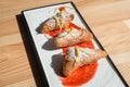 Spanish Leche Frita Dessert, decorated with jam close-up on a plate.