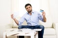 Spanish mexican business man worried paying bills on couch Royalty Free Stock Photo