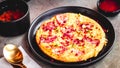 Spanish omelet Frittata made of eggs, potato, bacon, paprika, parsley, green peas, onion, cheese Royalty Free Stock Photo