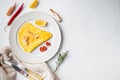 Spanish omelette, fresh red chilli, brown and white crabmeat, lemon, Cheddar cheese, eggs fried, on plate, on white background,