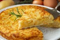 Spanish omelette with potatoes and onion, typical Spanish cuisine. Tortilla espanola. Rustic dark background