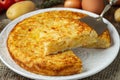 Spanish omelette with potatoes and onion, typical Spanish cuisine. Tortilla espanola. Rustic dark background Royalty Free Stock Photo