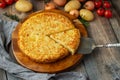 Spanish omelette with potatoes and onion, typical Spanish cuisine. Tortilla espanola. Rustic dark background. Top view Royalty Free Stock Photo