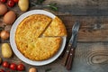 Spanish omelette with potatoes and onion, typical Spanish cuisine. Tortilla espanola. Rustic dark background. Top view Royalty Free Stock Photo