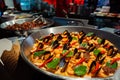 Spanish paella prepared in the street restaurant, close up