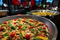 Spanish paella prepared in the street restaurant, close up