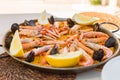 Spanish paella rice served on the pan under the sun