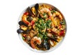 Spanish paella with saffron-infused rice, mixed seafood (shrimp, mussels, clams), chicken, chorizo, and
