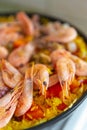 Spanish paella with sea food.Boiled shrimps with yellow rice & curcuma spice cooking in the kitchen.Delicious Mediterranean